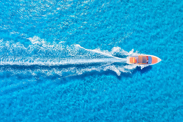 small speed boat in a body of water
